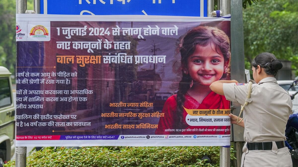 <div class="paragraphs"><p>A poster depicting the implementation of three new criminal laws -- Bharatiya Nyaya Sanhita, Bharatiya Nagarik Suraksha Sanhita and the Bharatiya Sakshya Adhiniyam -- being put by Delhi Police to raise awareness, in New Delhi.</p></div>