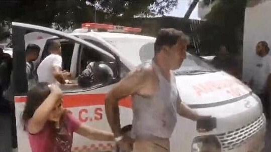 <div class="paragraphs"><p>A wounded girl is transported to Al Amal Hospital in Khan Younis, following deadly Israeli military strikes on an internally displaced persons tent encampment in the southern Gaza Strip, July 13, 2024 in this still image taken from social media video. </p></div>