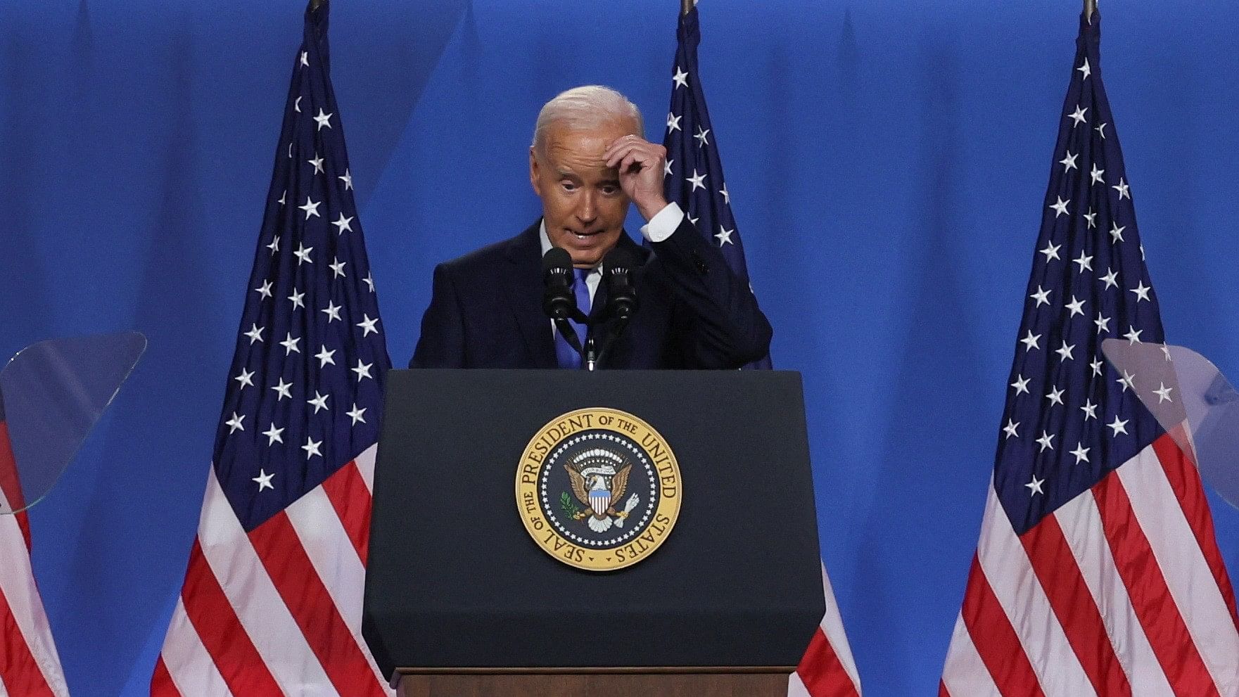 <div class="paragraphs"><p>US President Joe Biden reacts as he attends a press conference during NATO's 75th anniversary summit, in Washington, July 11, 2024.</p></div>