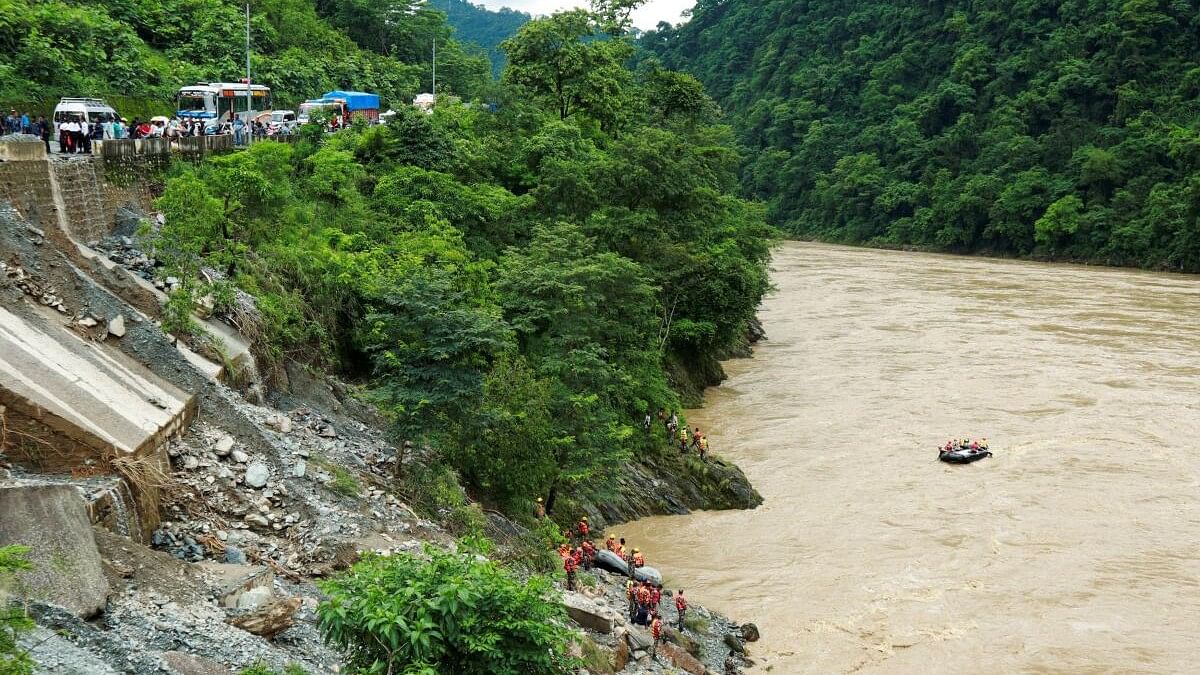 <div class="paragraphs"><p>Nepal searches for people missing after landslides sweep two buses into the Trishuli river.</p></div>