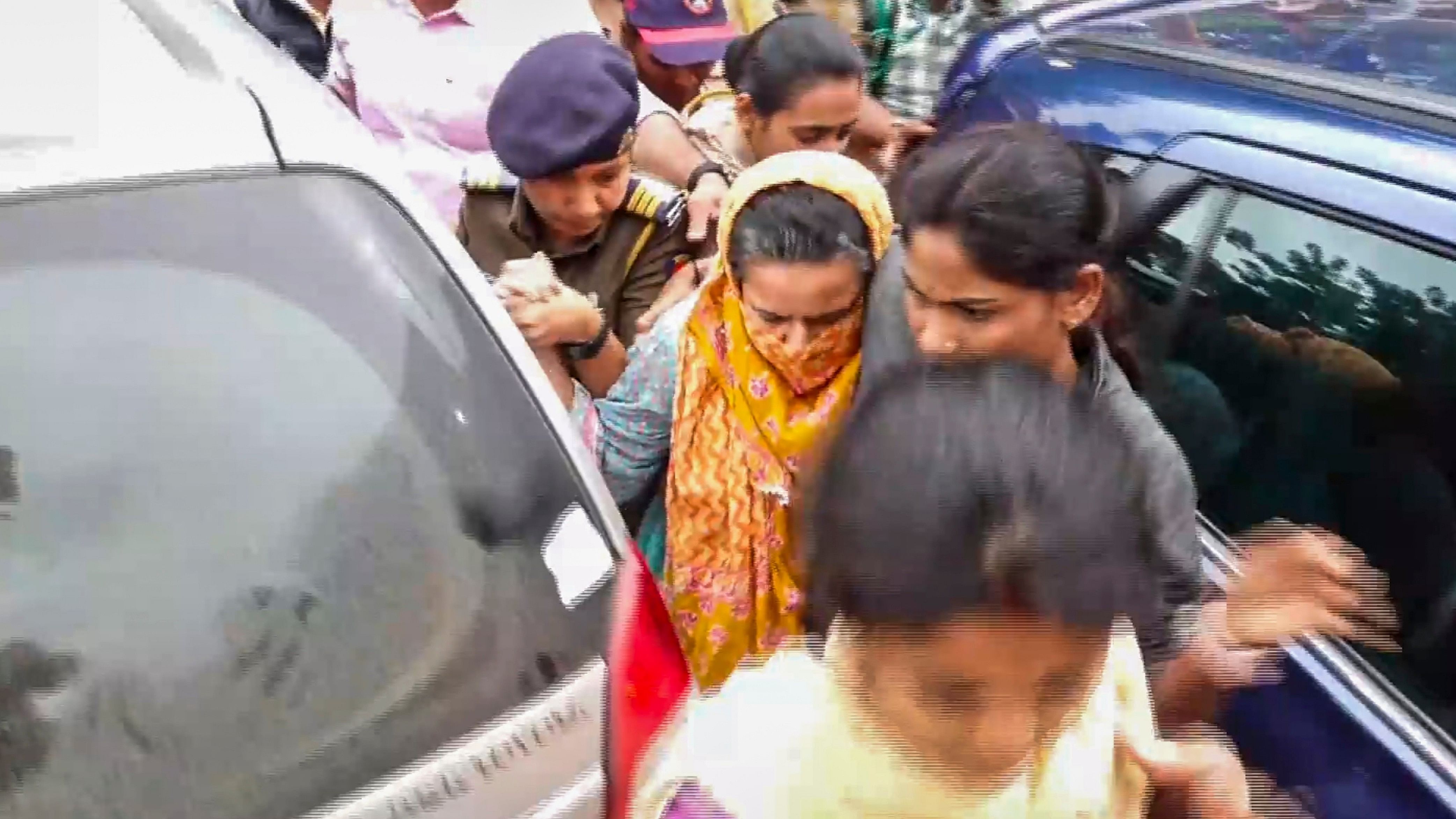 <div class="paragraphs"><p>Manorama Khedkar, mother of IAS probationer Puja Khedkar, being brought by the police to a hospital for medical examination after her arrest in a case of allegedly threatening some persons by brandishing a gun over a land dispute, in Pune district, Thursday, July 18, 2024. </p></div>