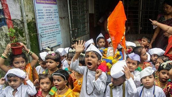 <div class="paragraphs"><p>Children take part in a religious procession ahead of Ashadhi Ekadashi festival</p></div>