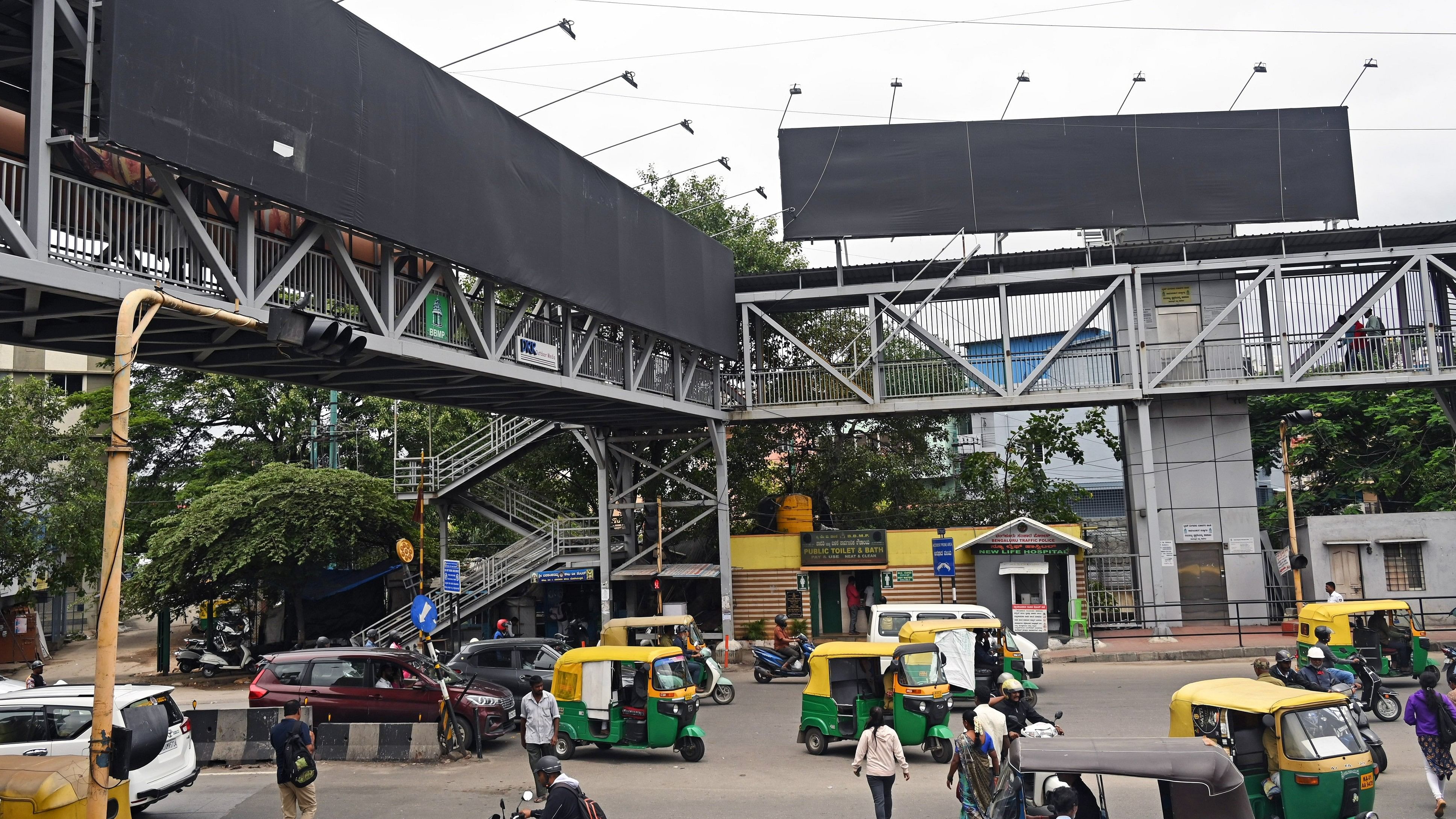 <div class="paragraphs"><p>Billboards on a skywalk on Mysuru Road remain empty. </p></div>