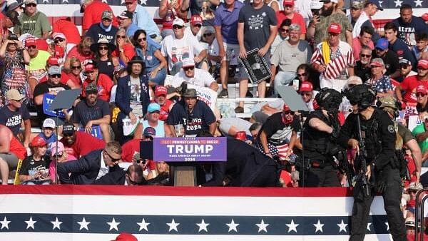 <div class="paragraphs"><p>Republican presidential candidate and former U.S. President Donald Trump is assisted by U.S. Secret Service personnel after gunfire rang out during a campaign rally at the Butler Farm Show in Butler, Pennsylvania, US, July 13, 2024.</p></div>