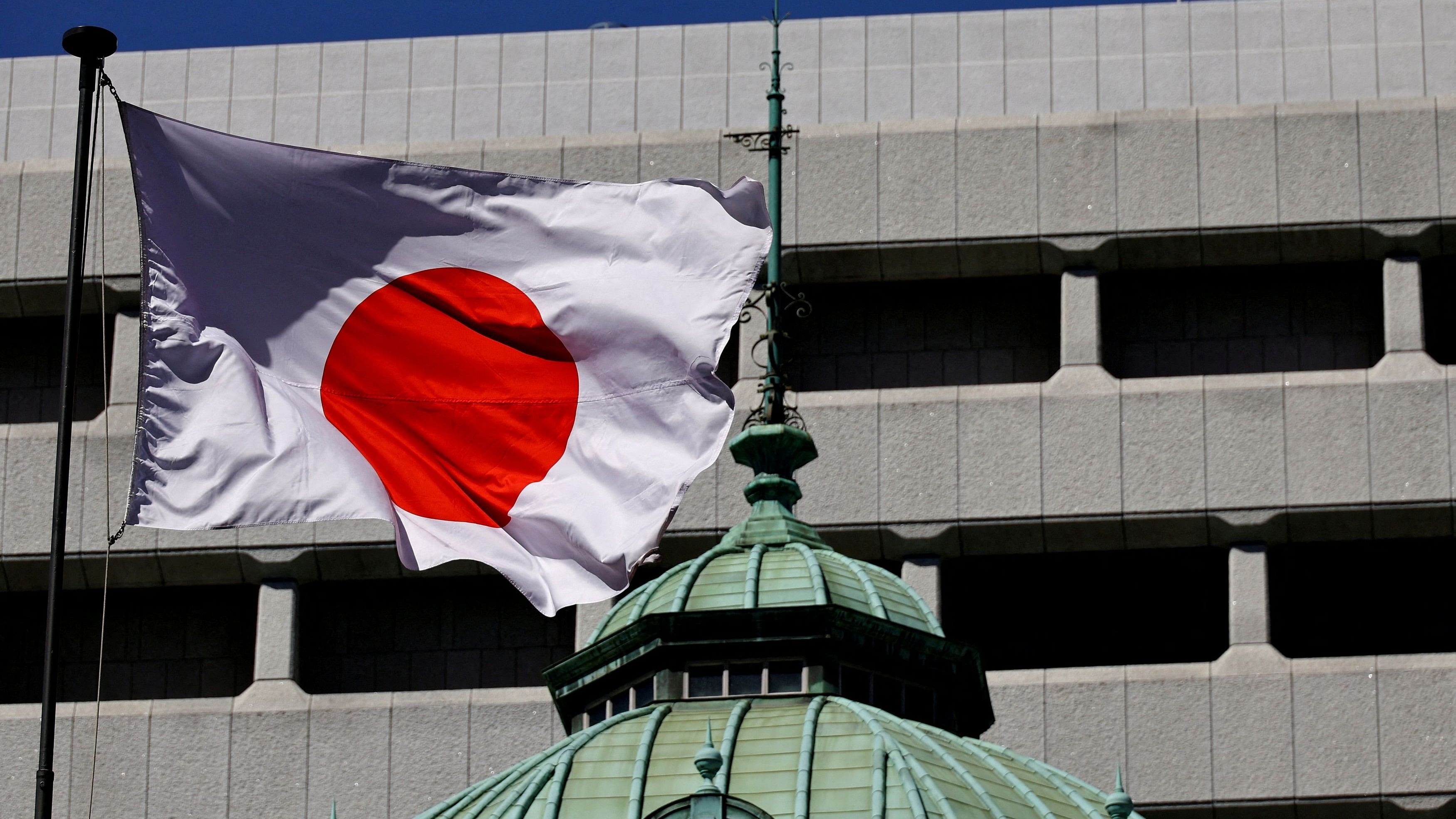 <div class="paragraphs"><p>The Japanese national flag waves at the Bank of Japan building in Tokyo.</p></div>