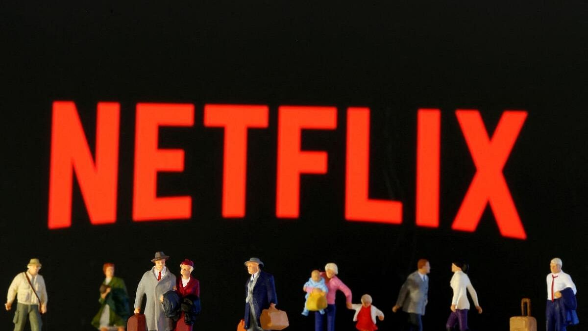 <div class="paragraphs"><p>Small toy figures are seen in front of displayed Netflix logo.</p></div>