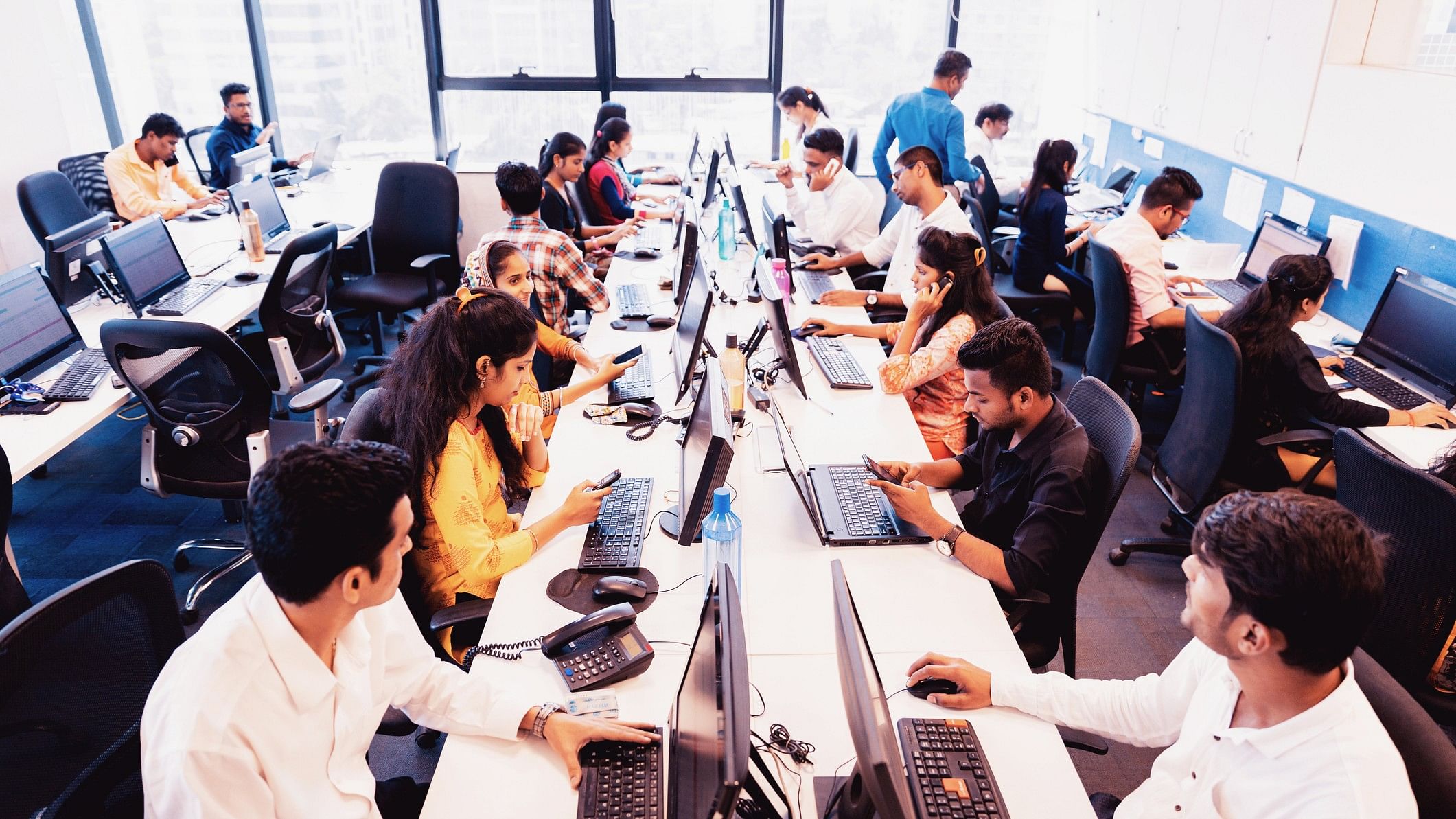 <div class="paragraphs"><p>Representative image shows Indian workers in an office</p></div>