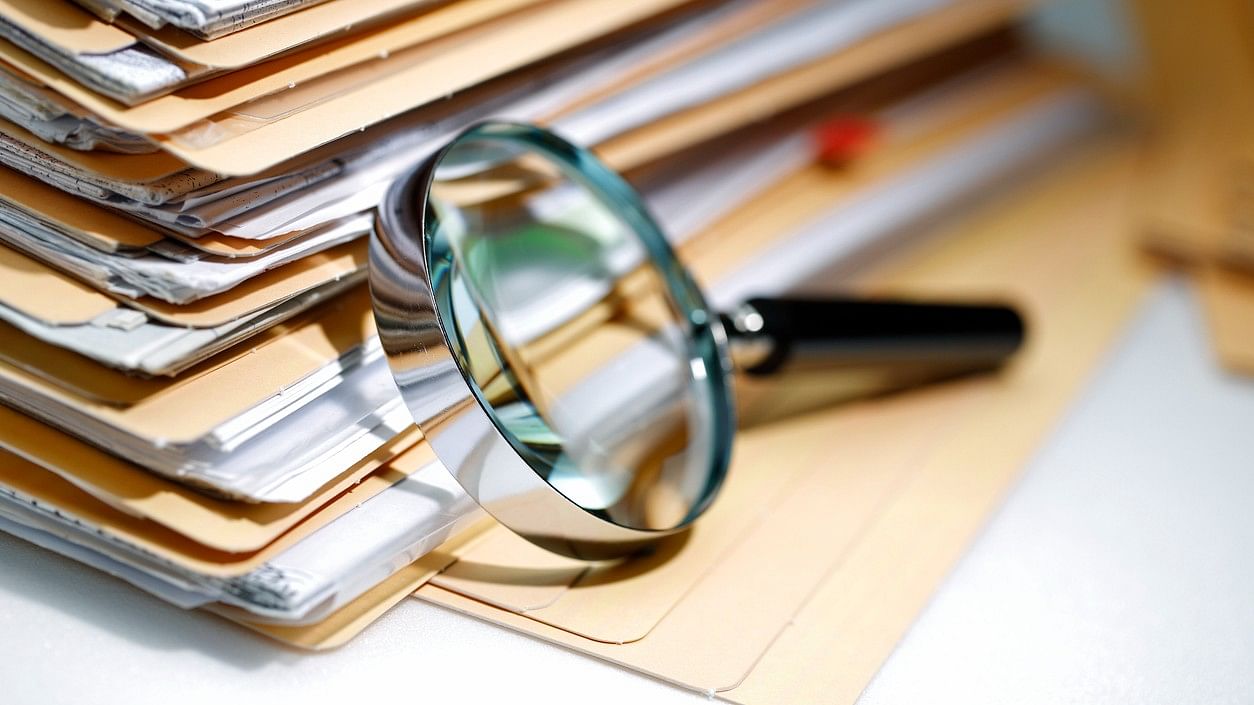 <div class="paragraphs"><p>Representative image showing a magnifying glass and a stack of files.</p></div>