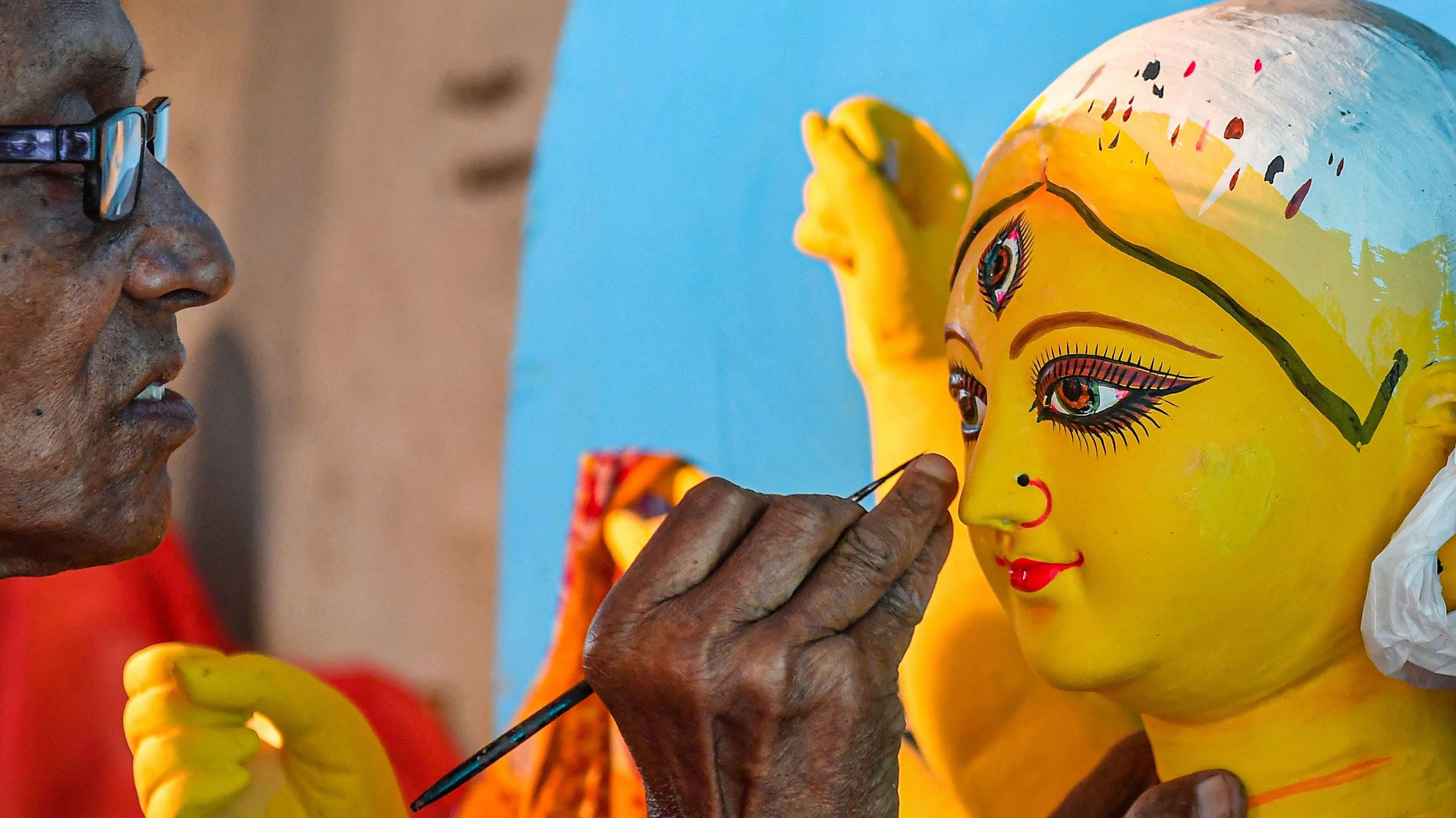 <div class="paragraphs"><p>An artist gives finishing touches to an idol of Goddess Durga ahead of the Durga Puja festival, at Kumartuli in Kolkata.</p></div>