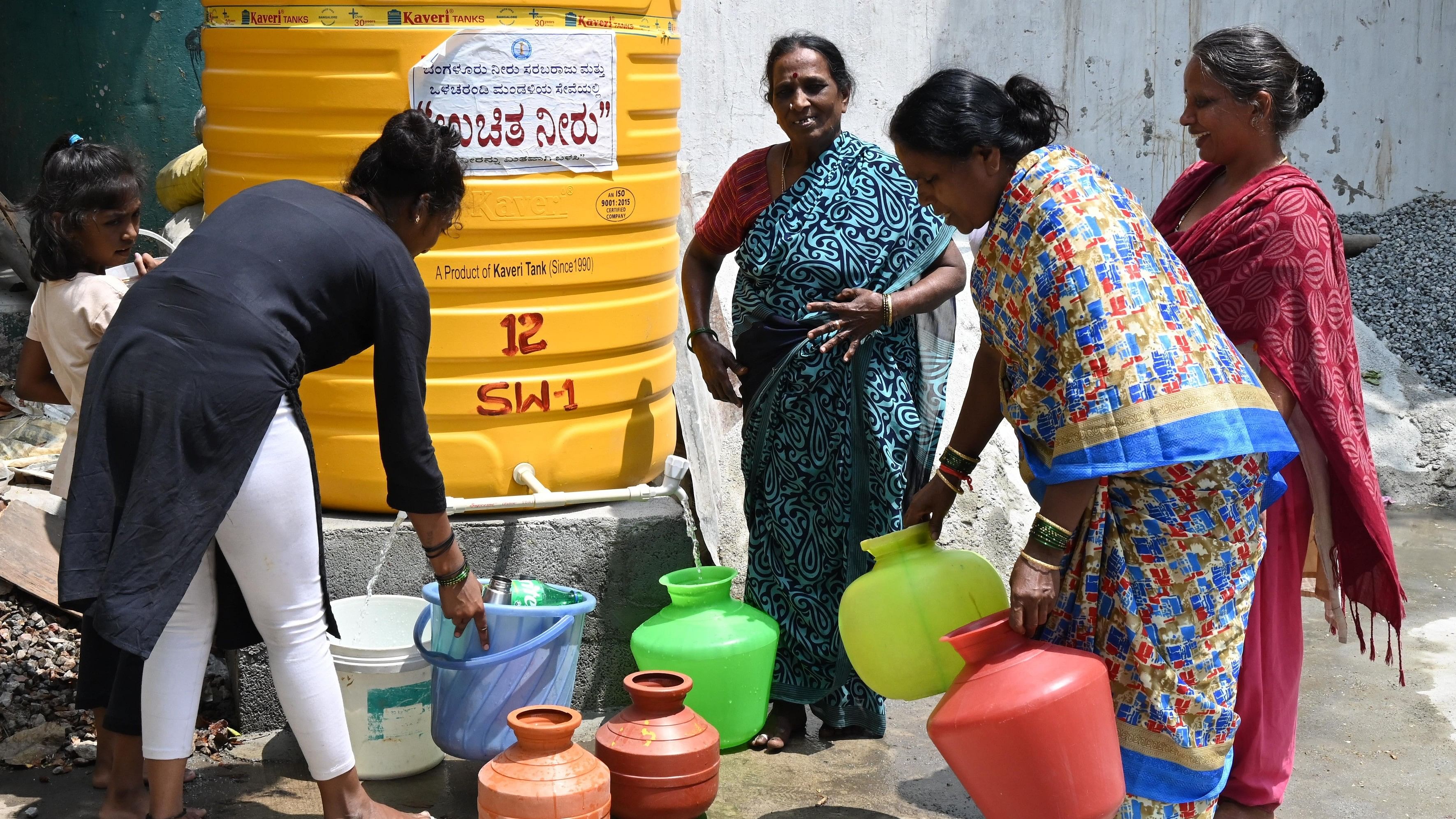 <div class="paragraphs"><p>Women fill water for free from BWSSB’s tank at Lakshman Puri in Bengaluru amidst water crisis in March. </p></div>