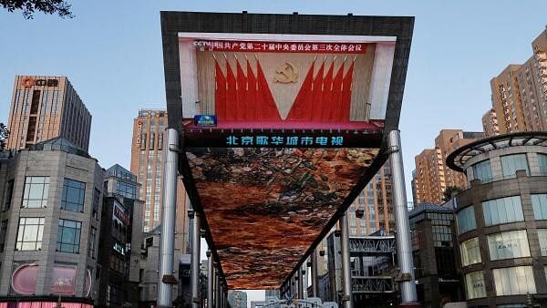 <div class="paragraphs"><p>Giant screen shows news footage of the third plenary session of the 20th Central Committee of the Communist Party of China (CPC), in Beijing.</p></div>