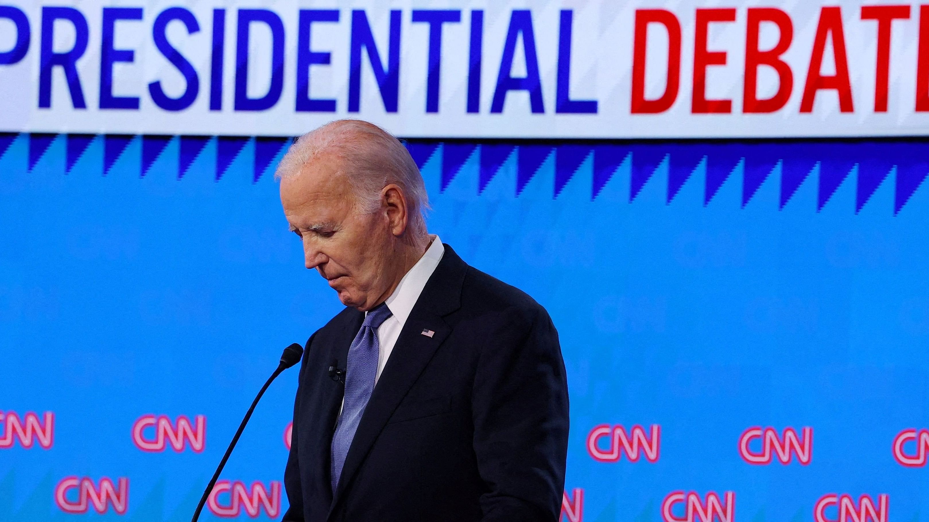 <div class="paragraphs"><p> Democrat presidential candidate US President Joe Biden listens as Republican presidential candidate and former US President Donald Trump speaks during their debate in Atlanta, Georgia, US, June 27, 2024. </p></div>