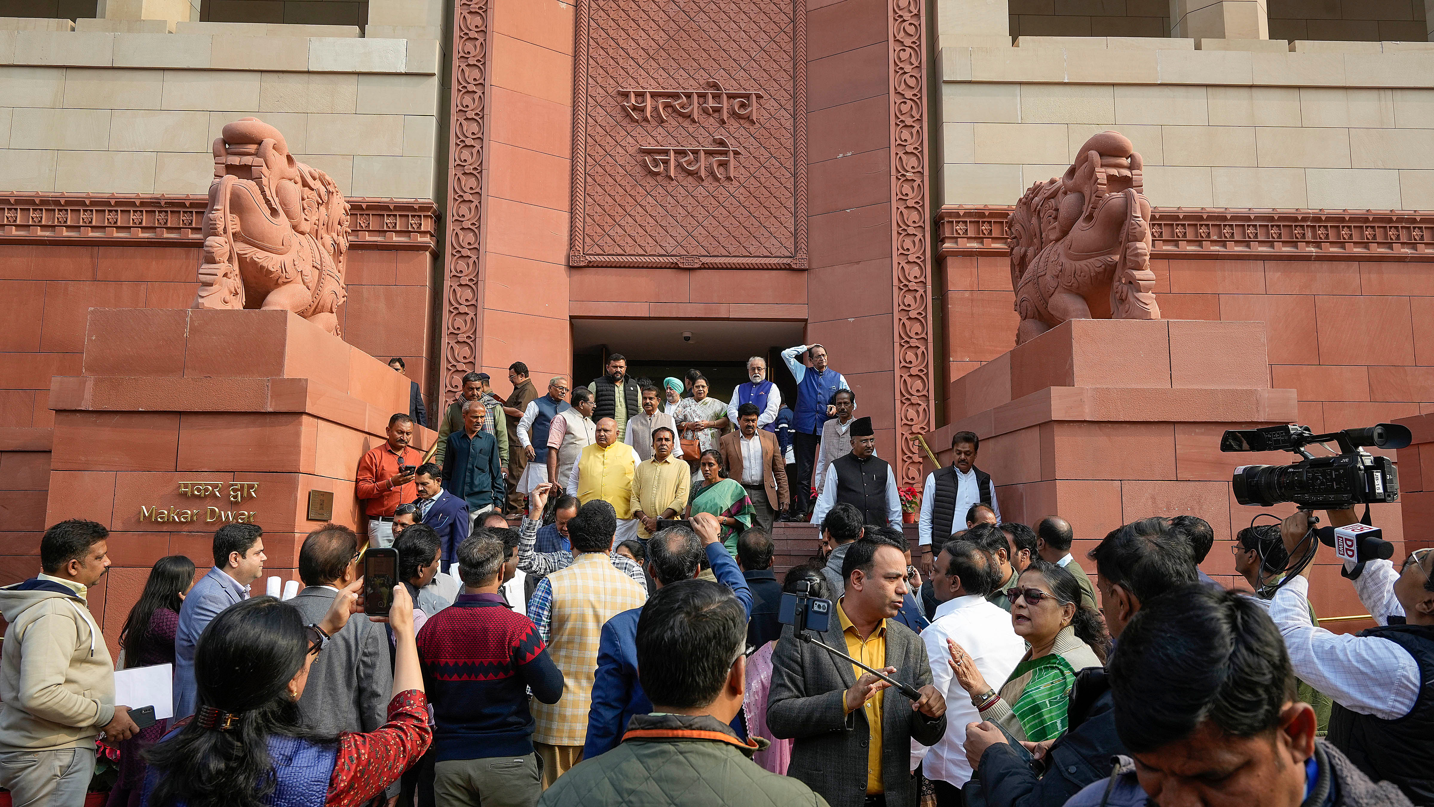 <div class="paragraphs"><p>Crowd outside the Parliament House after the Parliament was adjourned following a reported security breach during the Winter session, in New Delhi, Wednesday, Dec. 13, 2023.</p></div>