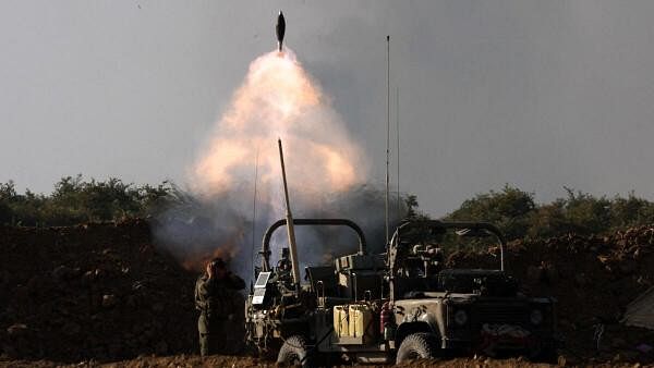 <div class="paragraphs"><p>An Israeli soldier fires a mortar amid the Israel-Hamas conflict, near the Israel-Gaza border in Israel on July 9, 2024.</p></div>