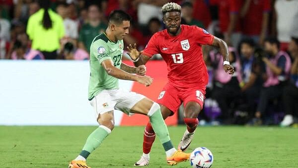 <div class="paragraphs"><p>Bolivia defender Hector Cuellar and Panama forward Freddy Gondola battle for the ball in the second half during a Copa America group stage match at Inter&amp;CO Stadium.</p></div>