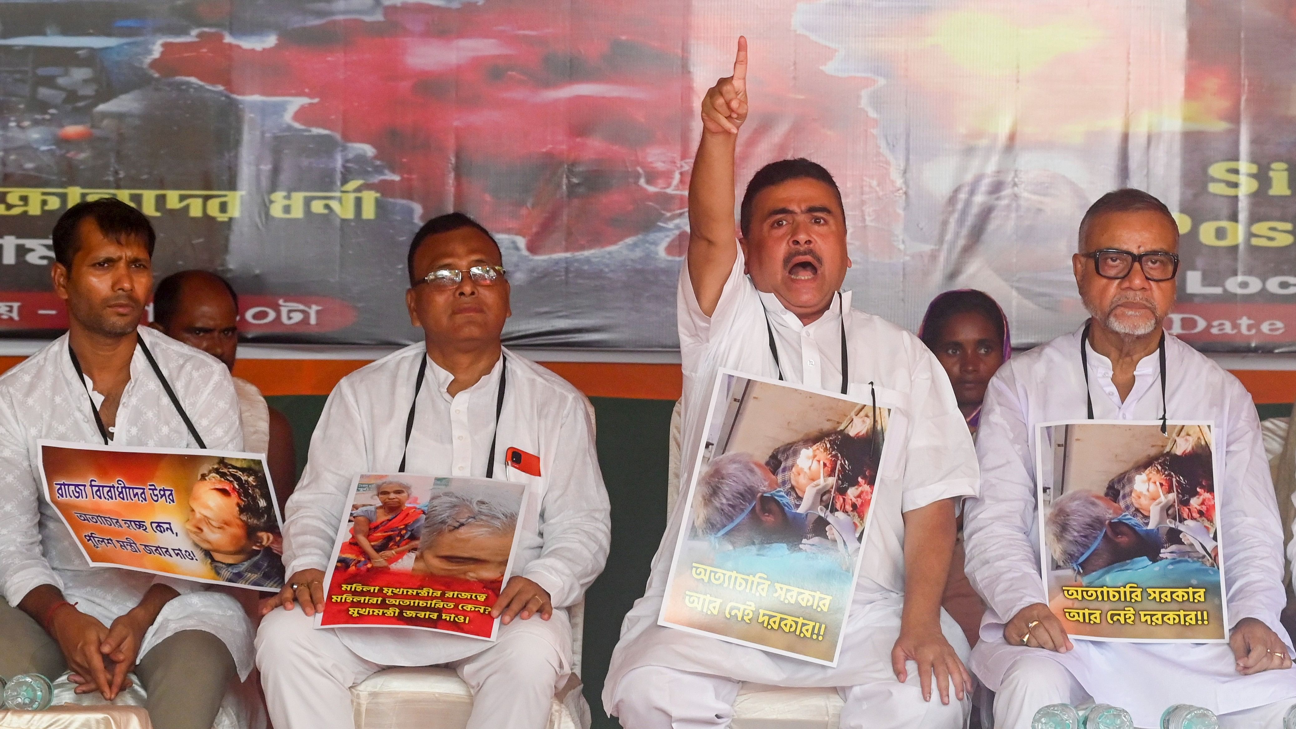 <div class="paragraphs"><p>Leader of Opposition in West Bengal Assembly and BJP leader Suvendu Adhikari with party leaders during a protest against the alleged violence in the state following general elections, near Raj Bhavan, in Kolkata, Sunday.</p></div>