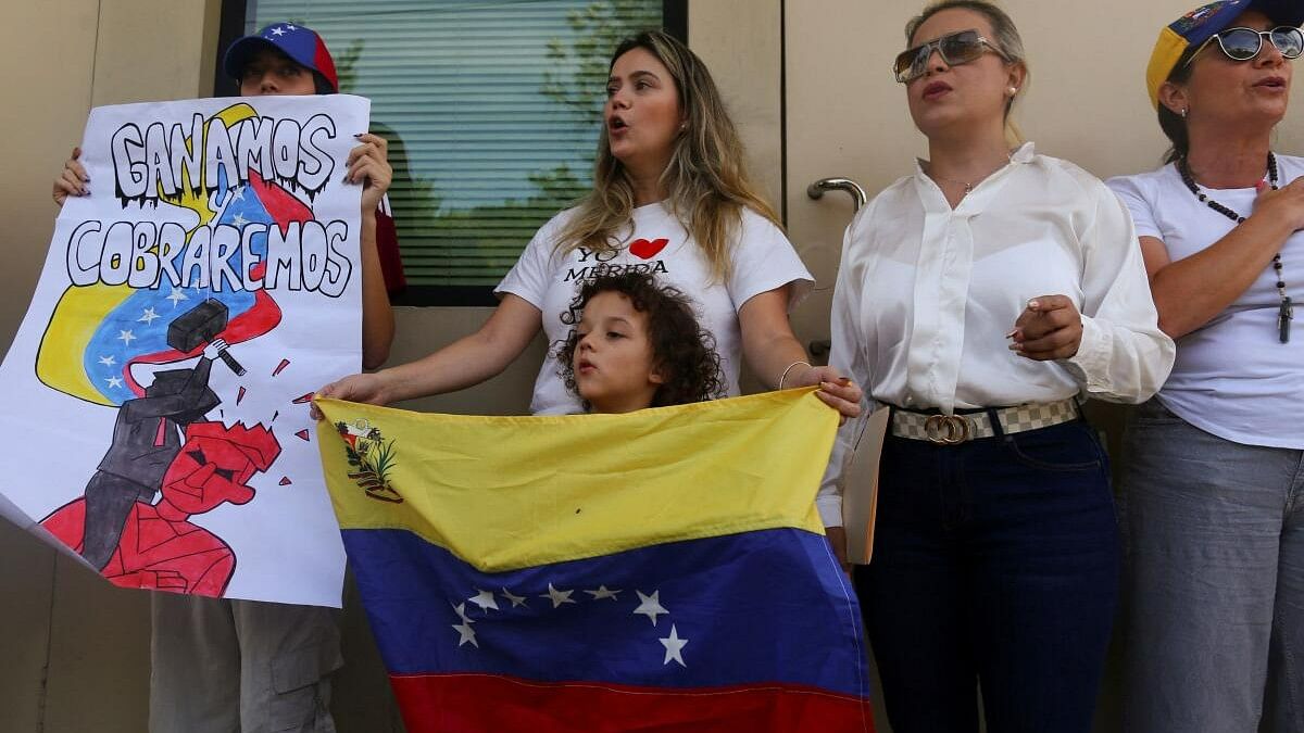 <div class="paragraphs"><p>Venezuelans living in El Salvador sing their national anthem during a protest against the election results that awarded Venezuelan President Nicolas Maduro a third term, at the UN offices in San Salvador, El Salvador, July 31, 2024.</p></div>