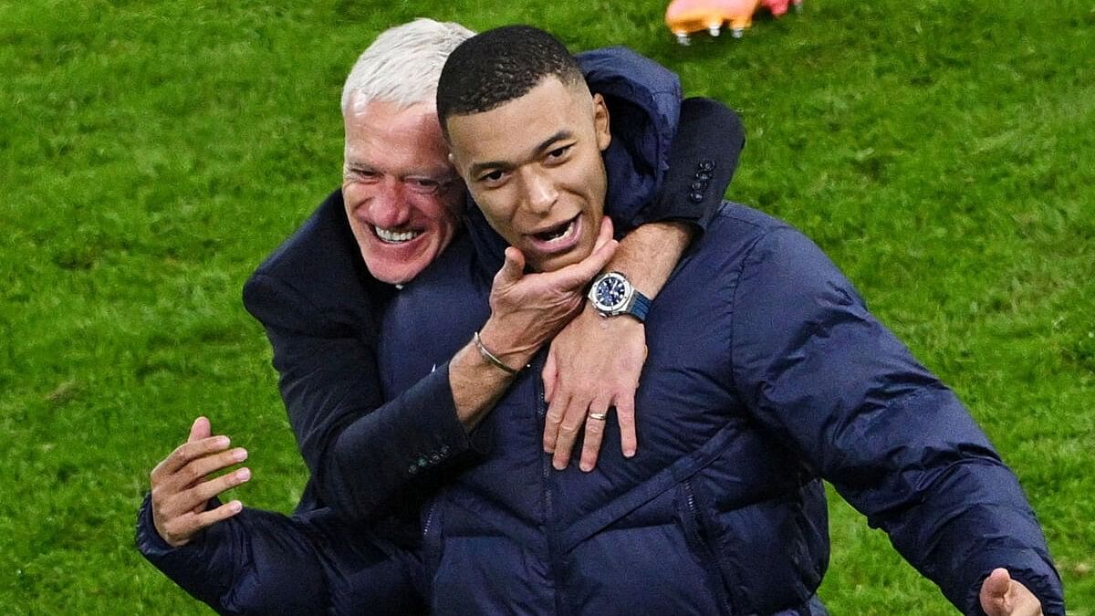 <div class="paragraphs"><p>Hamburg, Germany - July 5, 2024, France coach Didier Deschamps celebrates with Kylian Mbappe after winning the penalty shootout.</p></div>