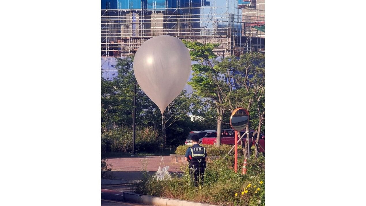 <div class="paragraphs"><p>A balloon believed to have been sent by North Korea, carrying various objects including what appeared to be trash, is pictured at a park in Incheon, South Korea,</p></div>