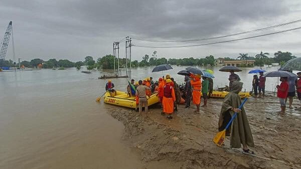 <div class="paragraphs"><p>SDRF personnel rescue people from a flood affected area following heavy monsoon rainfall, in Champawat district.</p></div>