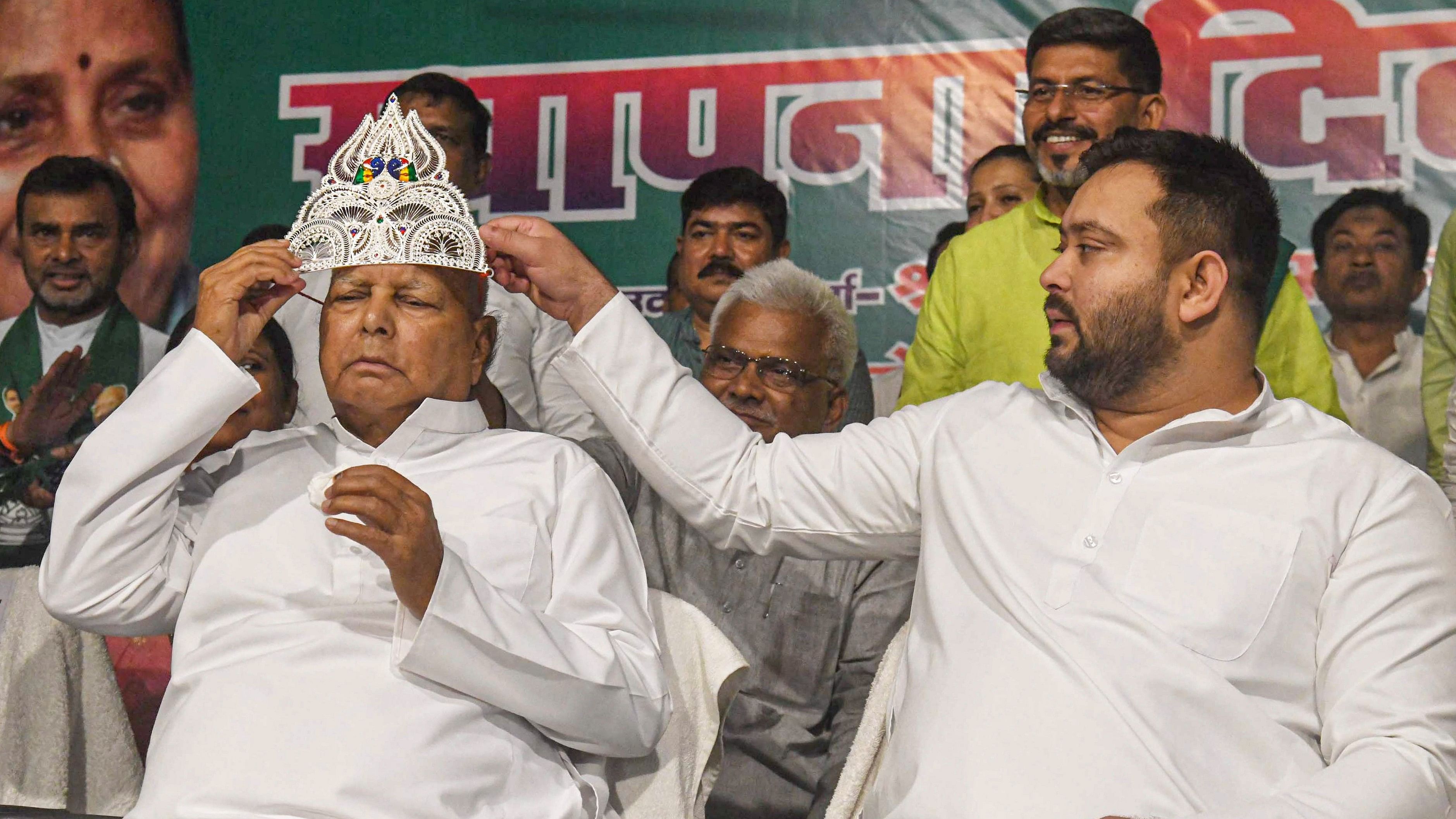 <div class="paragraphs"><p>RJD chief Lalu Prasad wears a sliver crown during the party's 28th Foundation Day function at the party office, in Patna, on Friday.</p></div>