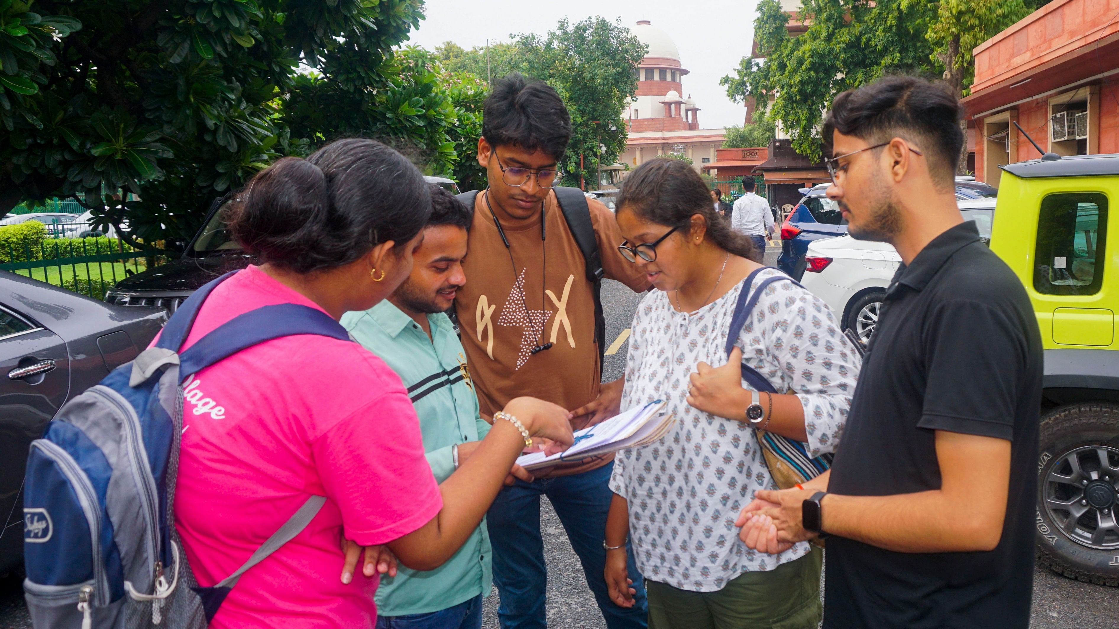 <div class="paragraphs"><p>NEET petitioners outside Supreme Court </p></div>