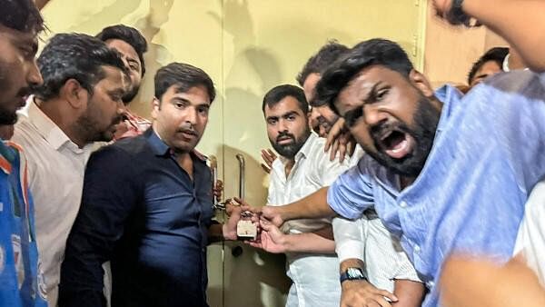 <div class="paragraphs"><p>Members of NSUI, Congress's students wing, raise slogans during their protest over the alleged rigging of the NEET UG exam, inside the office of the National Testing Agency (NTA), in Noida, Thursday, June 27, 2024.</p></div>