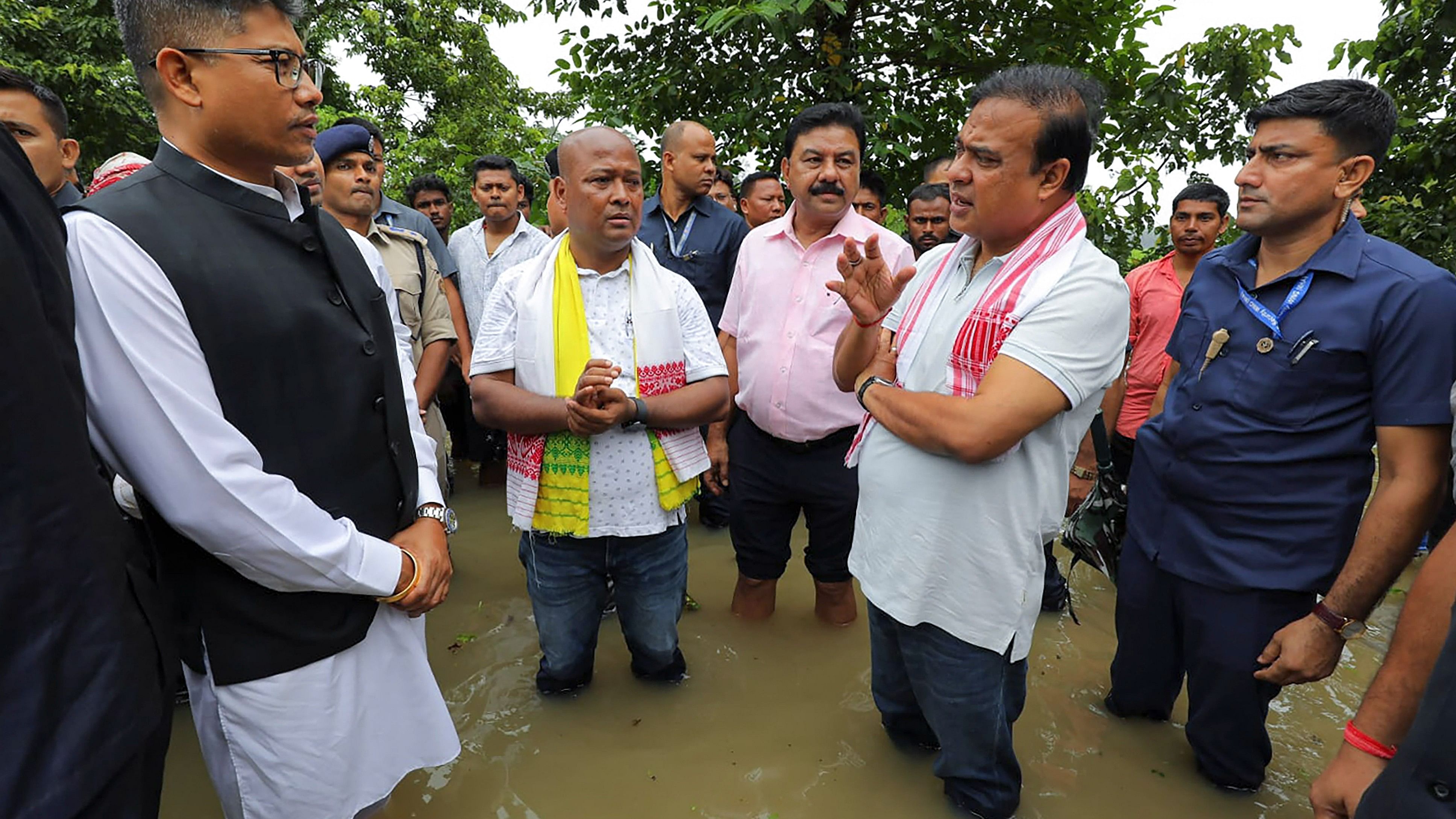 <div class="paragraphs"><p>Chief Minister Himanta Biswa Sarma interacts with others at a flood-affected area, in Dibrugarh district, Friday.</p></div>