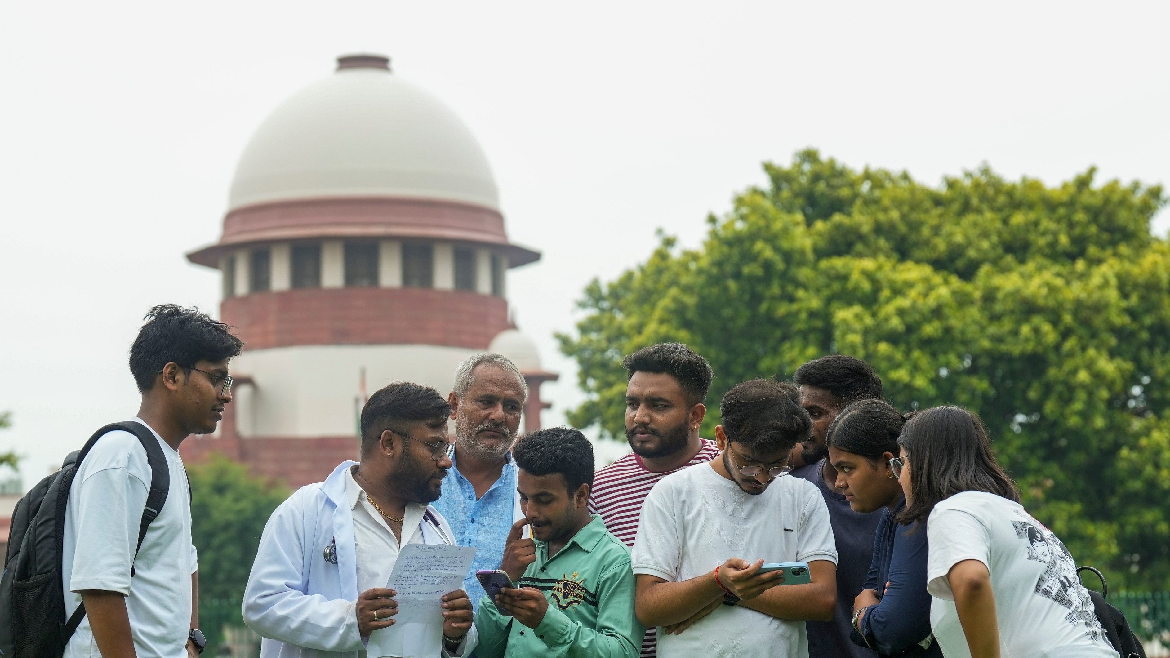 <div class="paragraphs"><p>Students and others are seen within the precinct of the Supreme Court (SC) of India during a hearing on a batch of petitions related to the controversy-ridden medical entrance exam NEET-UG 2024, in New Delhi, Thursday, July 18, 2024. </p></div>