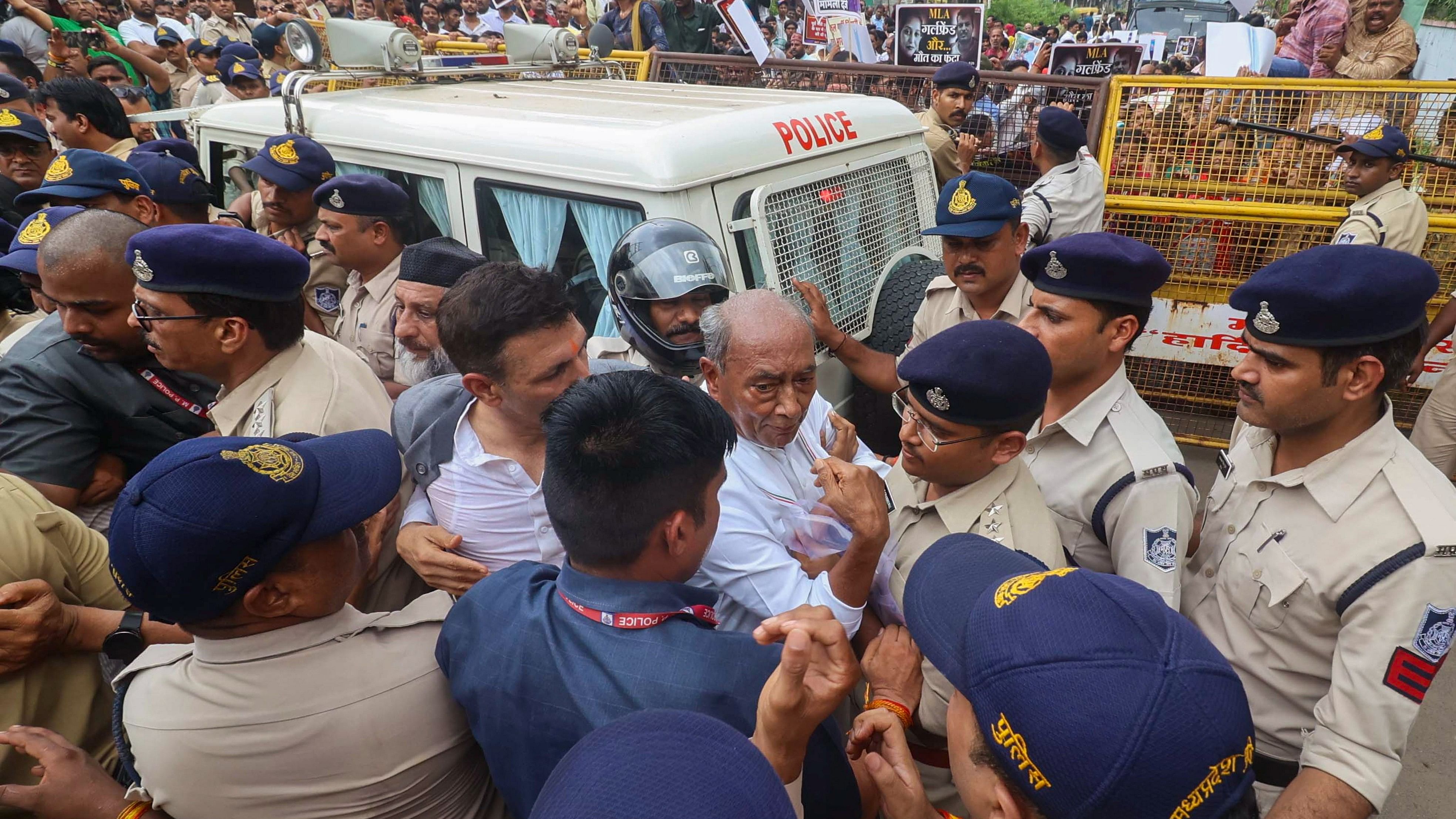 <div class="paragraphs"><p>Congress State President Jitu Patwari, senior party leader Digvijaya Singh and party workers during a protest rally demanding an FIR against Minister Vishwas Kailash Sarang and his resignation for allegedly being involved in nursing colleges scam, in Bhopal, Thursday.</p></div>