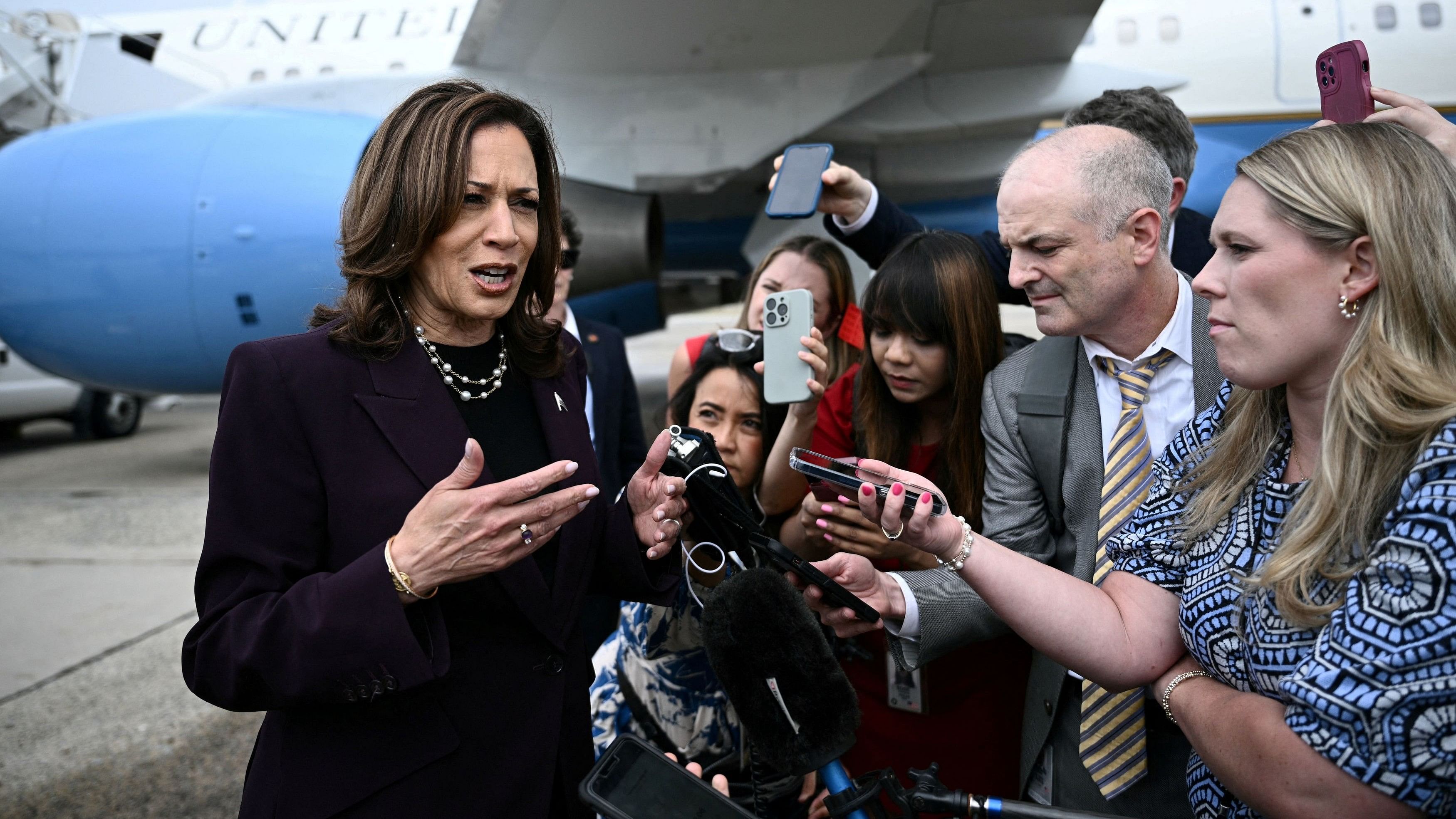 <div class="paragraphs"><p>Democratic presidential candidate US Vice President Kamala Harris speaks to reporters upon arrival at Joint Base Andrews in Maryland, U.S., July 25, 2024.</p></div>