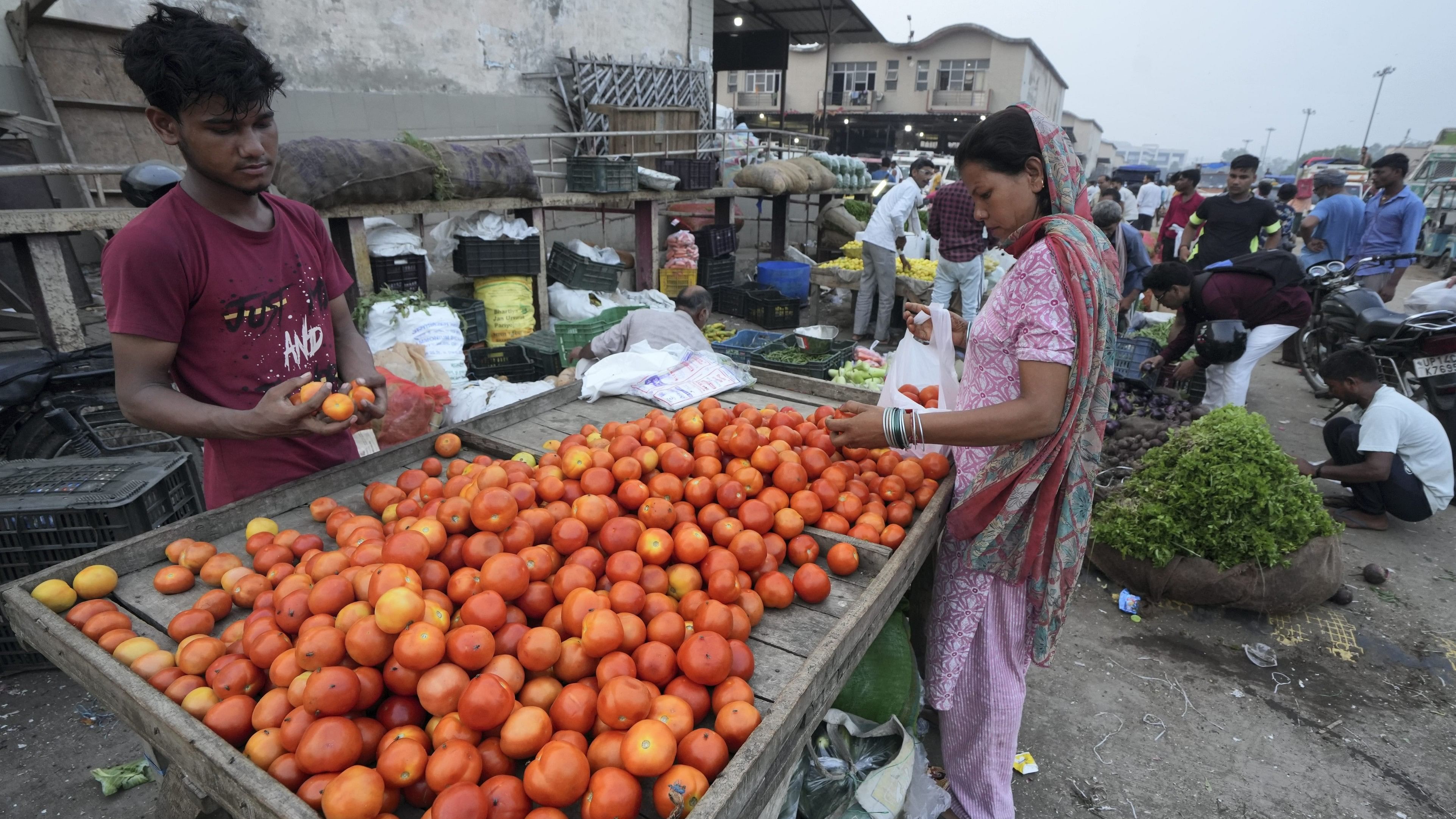 <div class="paragraphs"><p>Customers at the Ghazipur vegetable market, in New Delhi, Thursday, July 18, 2024. </p></div>