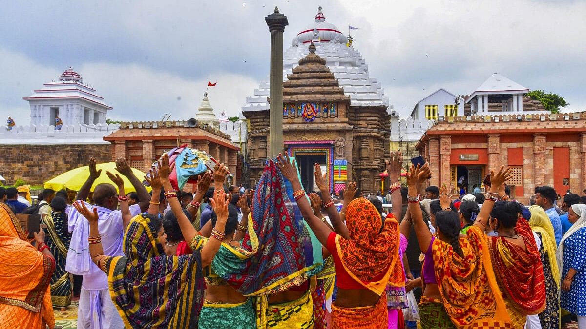 <div class="paragraphs"><p>Devotees during the reopening of ‘Ratna Bhandar’ at the Jagannath Temple, in Puri, Sunday, July 14 2024. Ratna Bhandar, the revered treasury of the 12th-century Jagannath temple, was reopened on Sunday after 46 years for an inventory of valuables and the repair of its structure, officials said. </p></div>