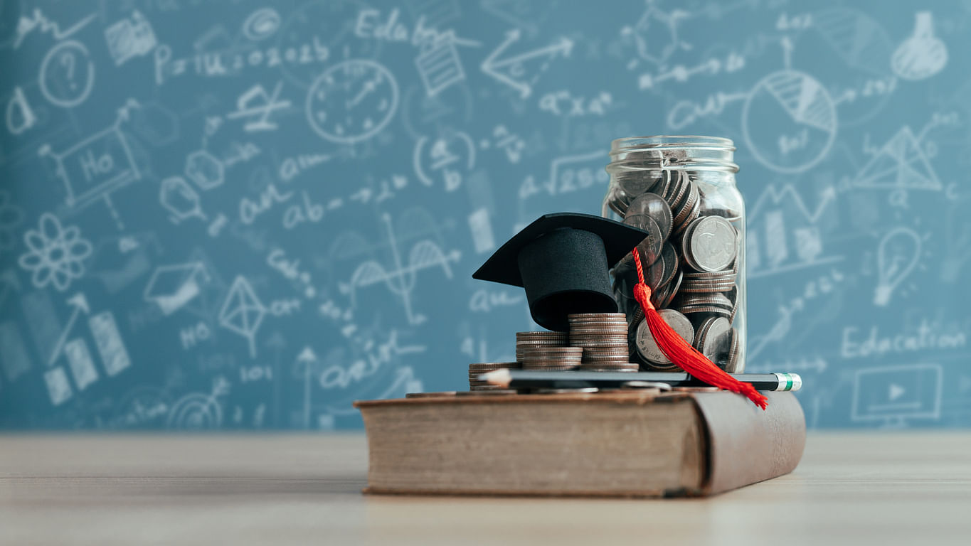 <div class="paragraphs"><p>Representative image showing a coin jar and a graduation cap.</p></div>