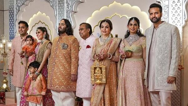 <div class="paragraphs"><p>Reliance Industries Chairman Mukesh Ambani with wife Nita Ambani, sons Akash and Anant Ambani, daughter-in-law Shloka Mehta Ambani, daughter Isha Ambani and son-in-law Anand Piramal, poses for pictures upon their arrival for Anant and Radhika Merchant's wedding, at Jio World Convention Centre, in Mumbai, Friday.&nbsp;</p></div>