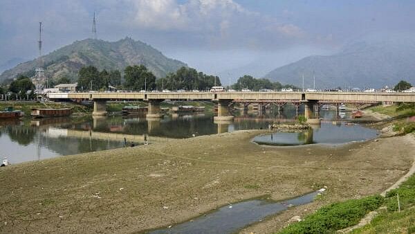 <div class="paragraphs"><p>River Jhelum, partially dried due to a long spell of dry weather and heatwave conditions, in Srinagar.</p></div>