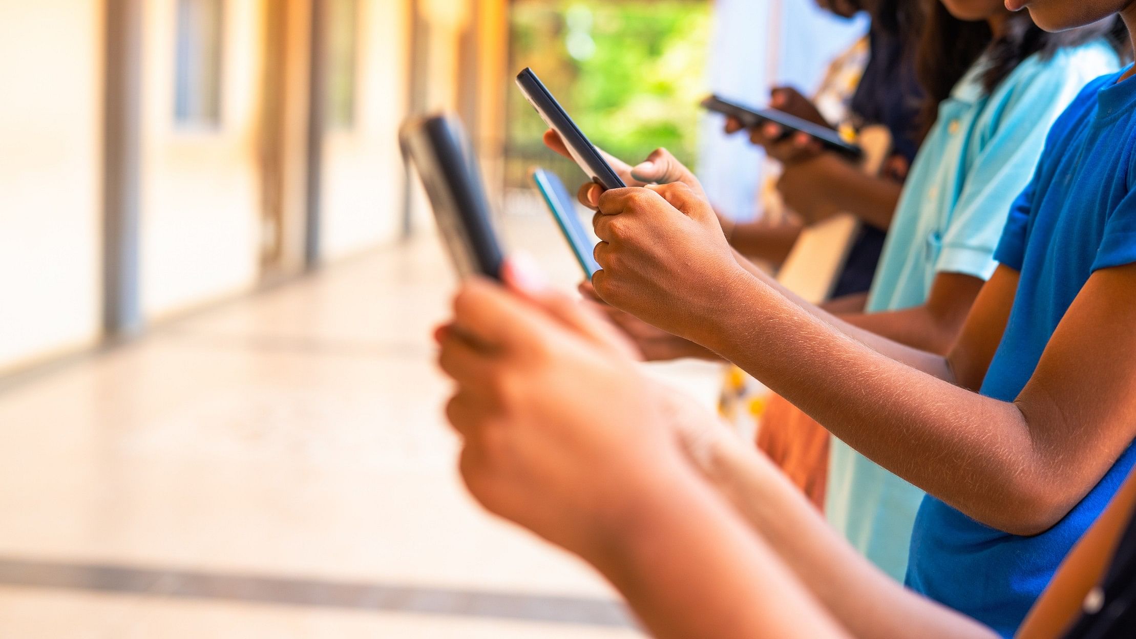 <div class="paragraphs"><p>Representative image showing teenagers with phones in their hands</p></div>