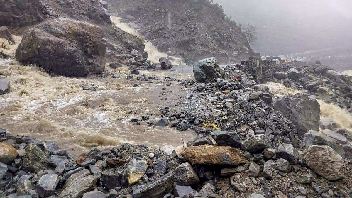 <div class="paragraphs"><p>Debris lies on the Chamoli-Badrinath National Highway near Lambagad after a landslide after rain, in Chamoli district, Uttarakhand.</p></div>