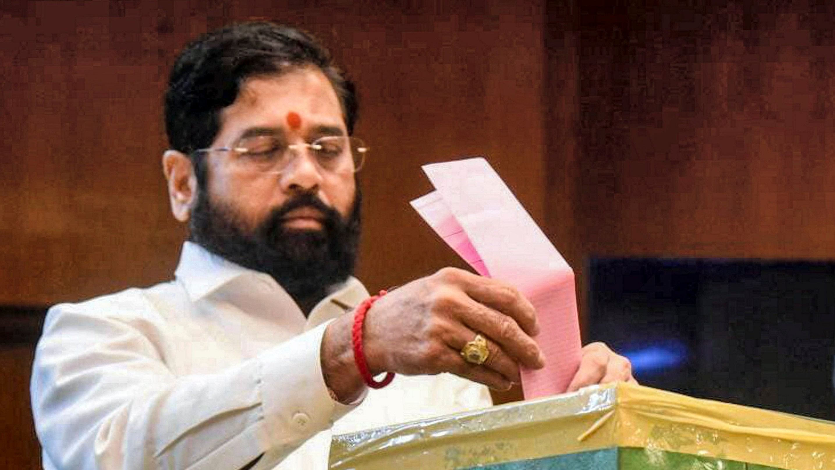 <div class="paragraphs"><p>Maharashtra Chief Minister Eknath Shinde casts his vote for the State Legislative Council elections, in Mumbai. </p></div>