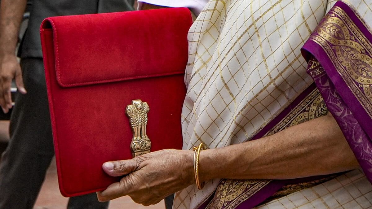 <div class="paragraphs"><p>Union Finance Minister Nirmala Sitharaman with a red pouch carrying the Budget documents.</p></div>