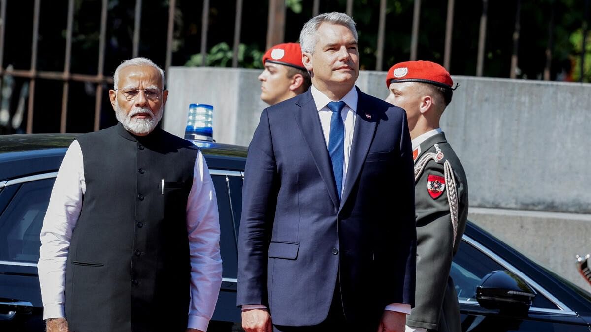 <div class="paragraphs"><p>Austrian Chancellor Karl Nehammer and Indian Prime Minister Narendra Modi review the Guard of Honour in Vienna, Austria, July 10, 2024. </p></div>