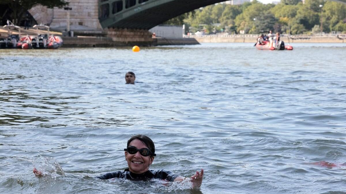 <div class="paragraphs"><p>File photo of Paris Mayor Anne Hidalgo swimming in the Seine, to demonstrate that the river is clean enough to host the outdoor swimming events at the Paris Olympics.&nbsp;</p></div>