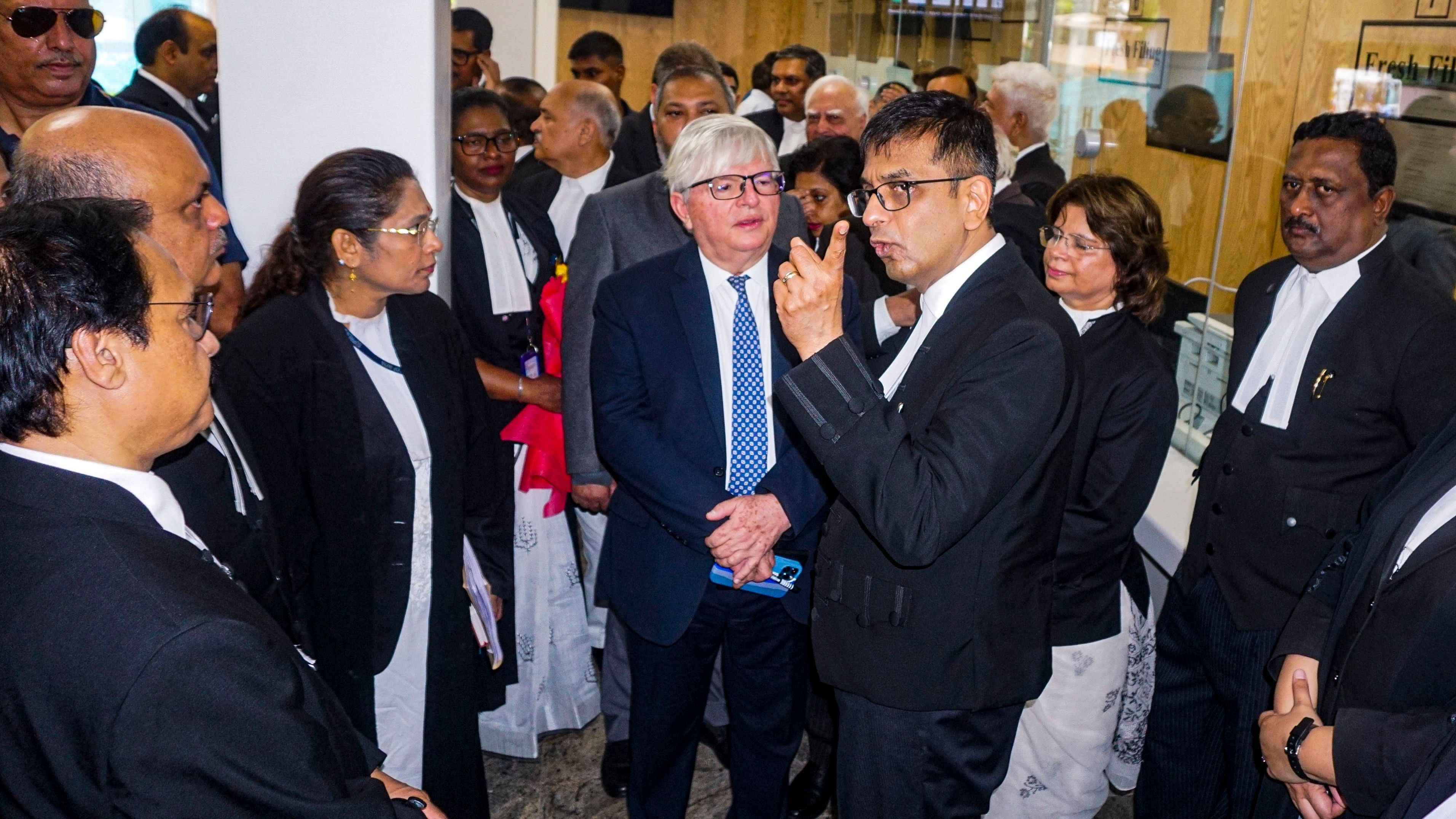 <div class="paragraphs"><p>Chief Justice of India (CJI) Justice DY Chandrachud with Justice Antonio Benjamin from Brazil and others during the inauguration of a new filing counter at the Supreme Court (SC) of India, in New Delhi.</p></div>