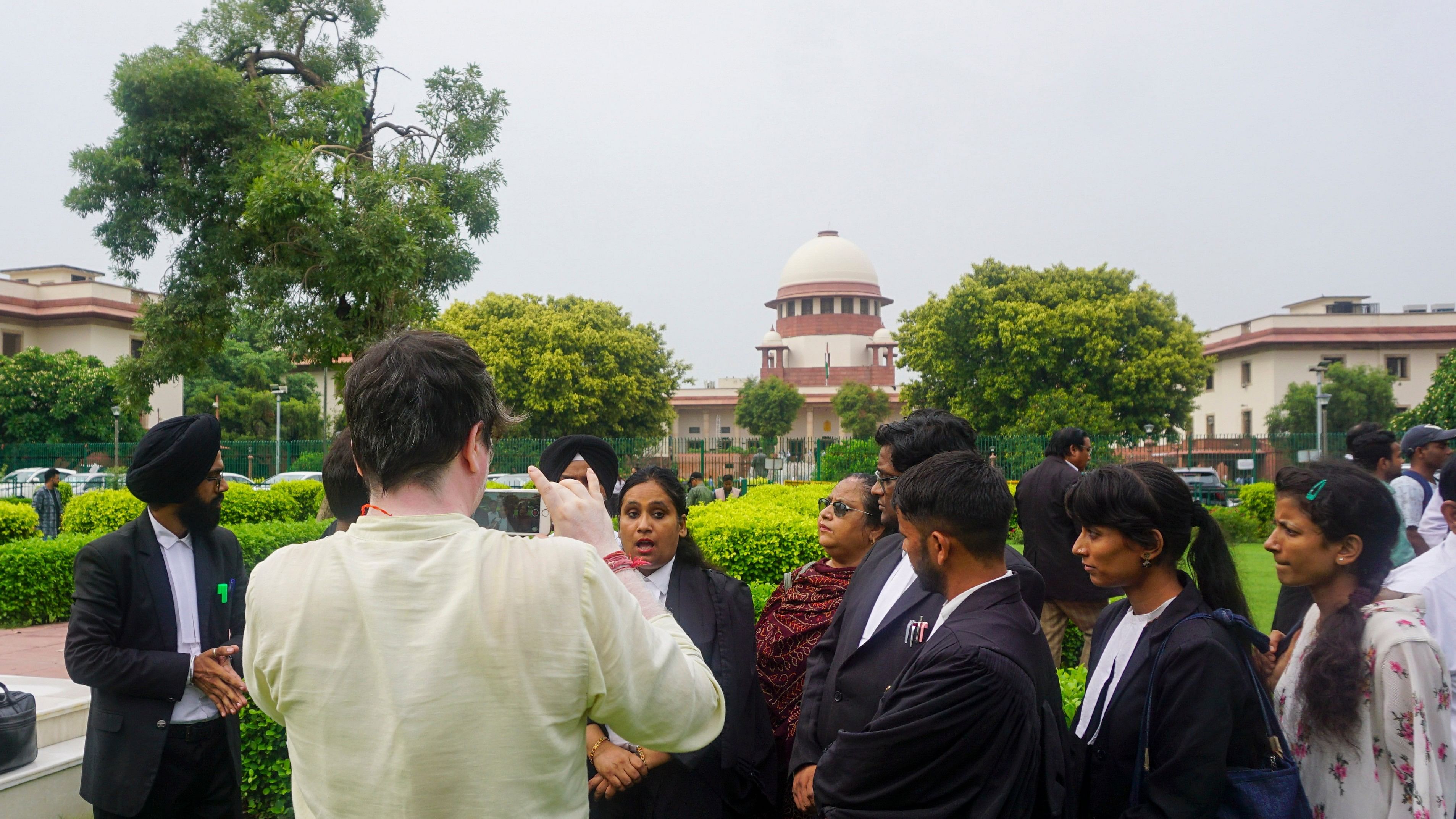 <div class="paragraphs"><p>Lawyers speak to the media outside the Supreme Court after the hearing regarding the alleged irregularities in the conduct of the exam, in New Delhi, Monday, July 22, 2024. </p></div>