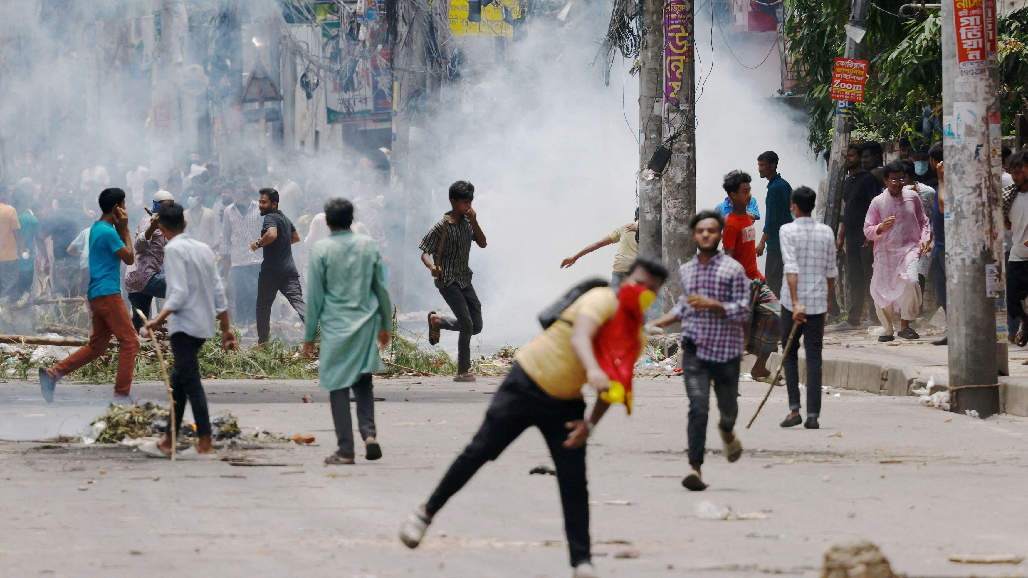 <div class="paragraphs"><p> Protesters clash with Border Guard Bangladesh  and the police outside the state-owned Bangladesh Television as violence erupts across the country after anti-quota protests by students, in Dhaka, Bangladesh.</p></div>