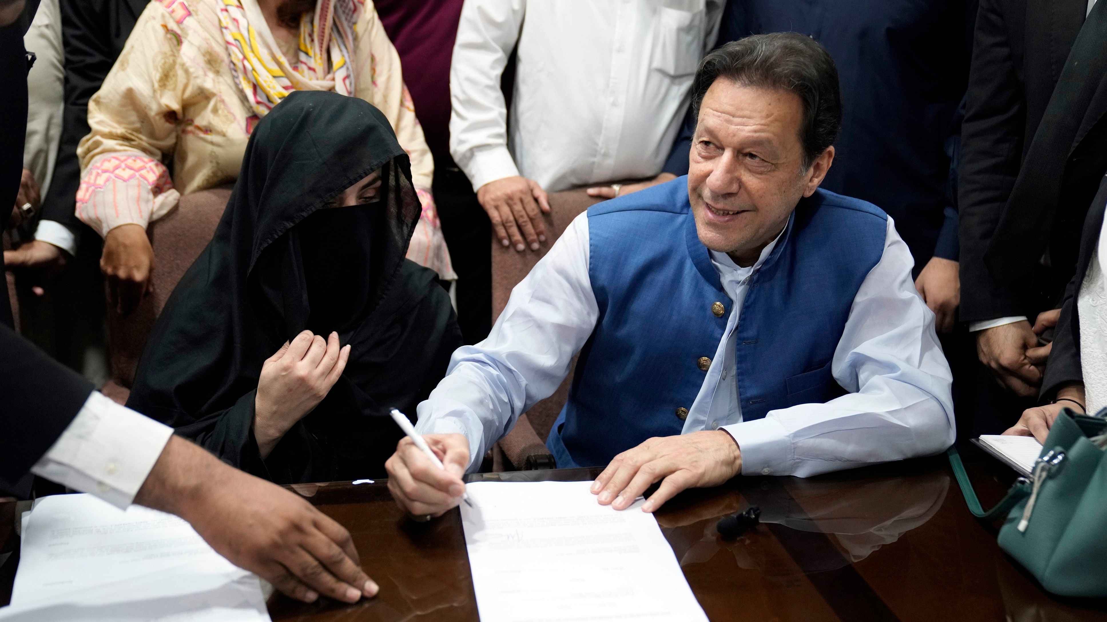 <div class="paragraphs"><p> Pakistan's former Prime Minister Imran Khan, right, and Bushra Bibi, his wife.&nbsp;</p></div>