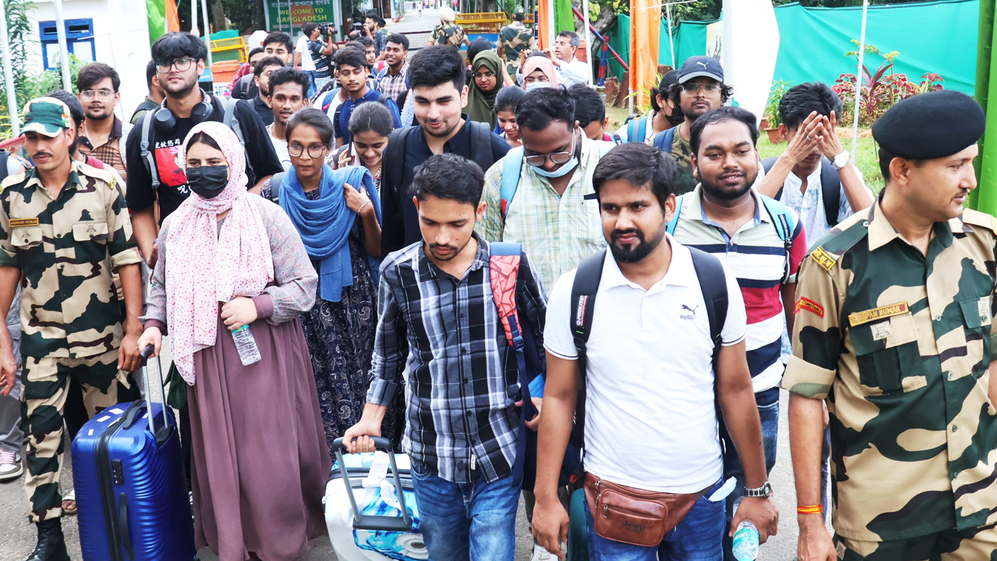 <div class="paragraphs"><p>Students, who are studying in Bangladesh, upon their arrival following protest against the government job quota, at the Akhura Check post, in Agartala, Saturday, July 20, 2024.</p></div>