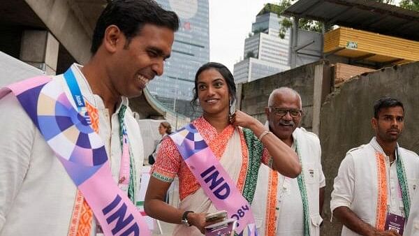 <div class="paragraphs"><p> Sindhu of India, with others, arrives to board the boat in Paris, France, for the opening ceremony of the 2024 Summer Olympics. </p></div>