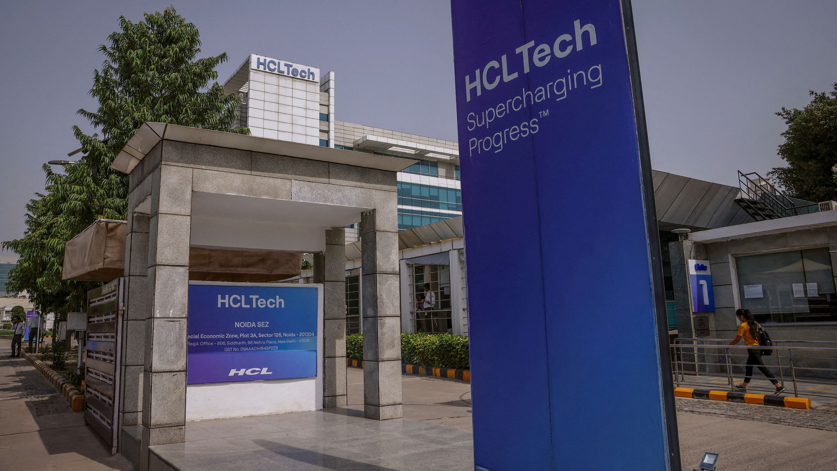 <div class="paragraphs"><p>An employee arrives for work at HCL Technologies headquarters in Noida</p></div>