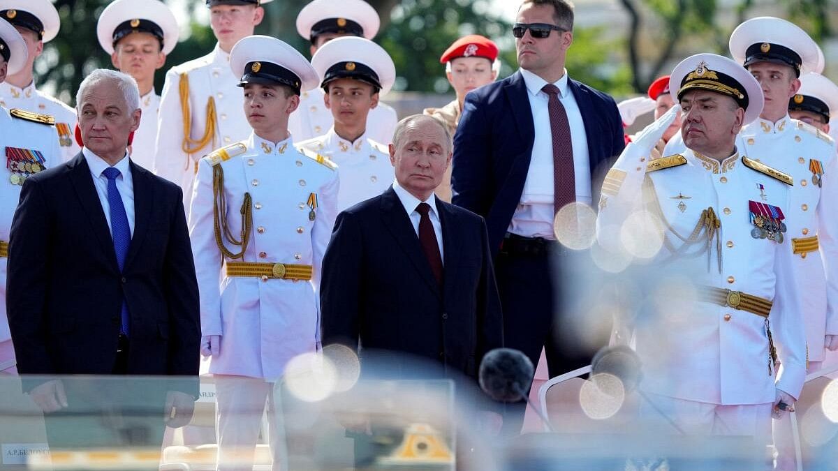 <div class="paragraphs"><p>Spectators, including Russia's President Vladimir Putin, Defence Minister Andrei Belousov and Russian Navy Commander-in-Chief Admiral Alexander Moiseyev, watch the annual Navy Day parade in Saint Petersburg, Russia.</p></div>